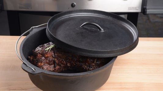 Why is the Dutch oven called a versatile artifact in the cooking world?