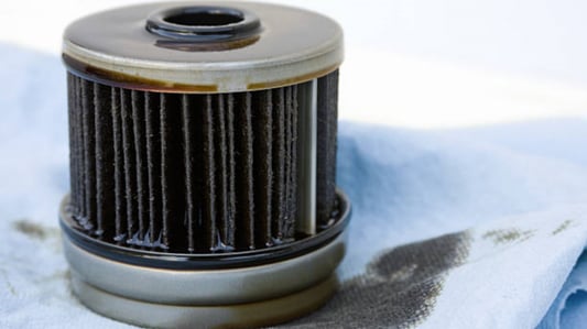 What is the difference between a spin-on filter and a cartridge filter?