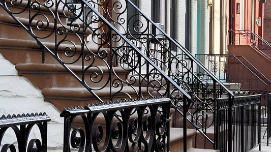 Choosing Between Straight and Scroll Iron Balusters for Impact