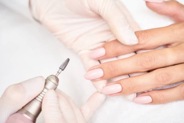 What does a nail drill do to your nails?