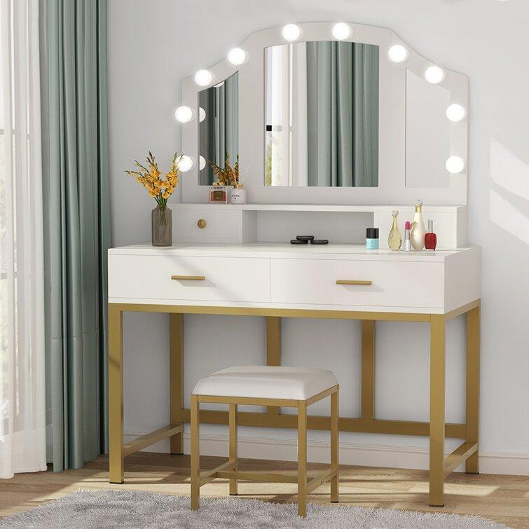 bedroom vanity with lighted mirror